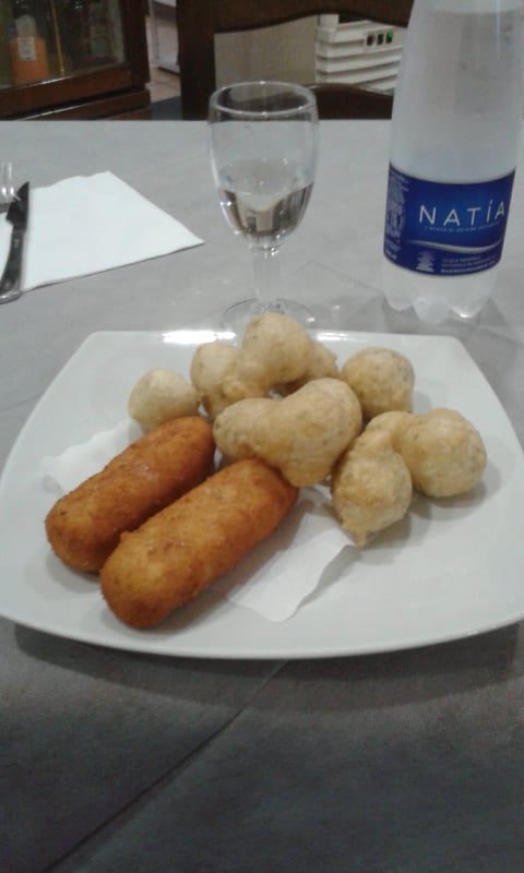 Real fried zeppole and panzerotti on a plate
