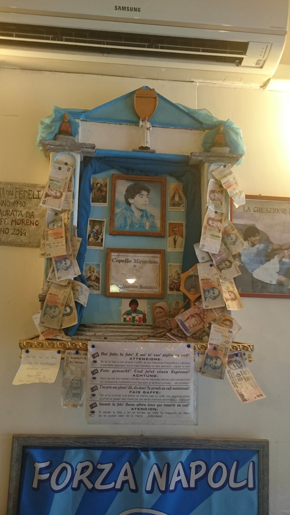 The Maradona shrine with the framed Capello Miracoloso inside Bar Nilo