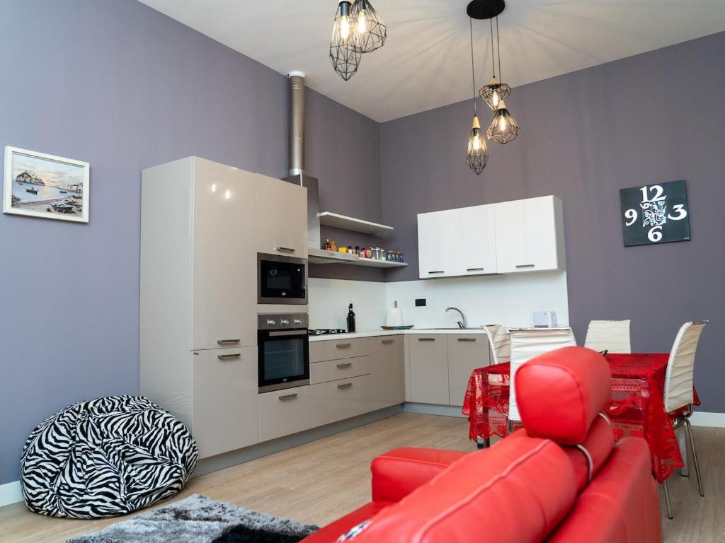 Open living area with a fully equipped kitchen and dining table